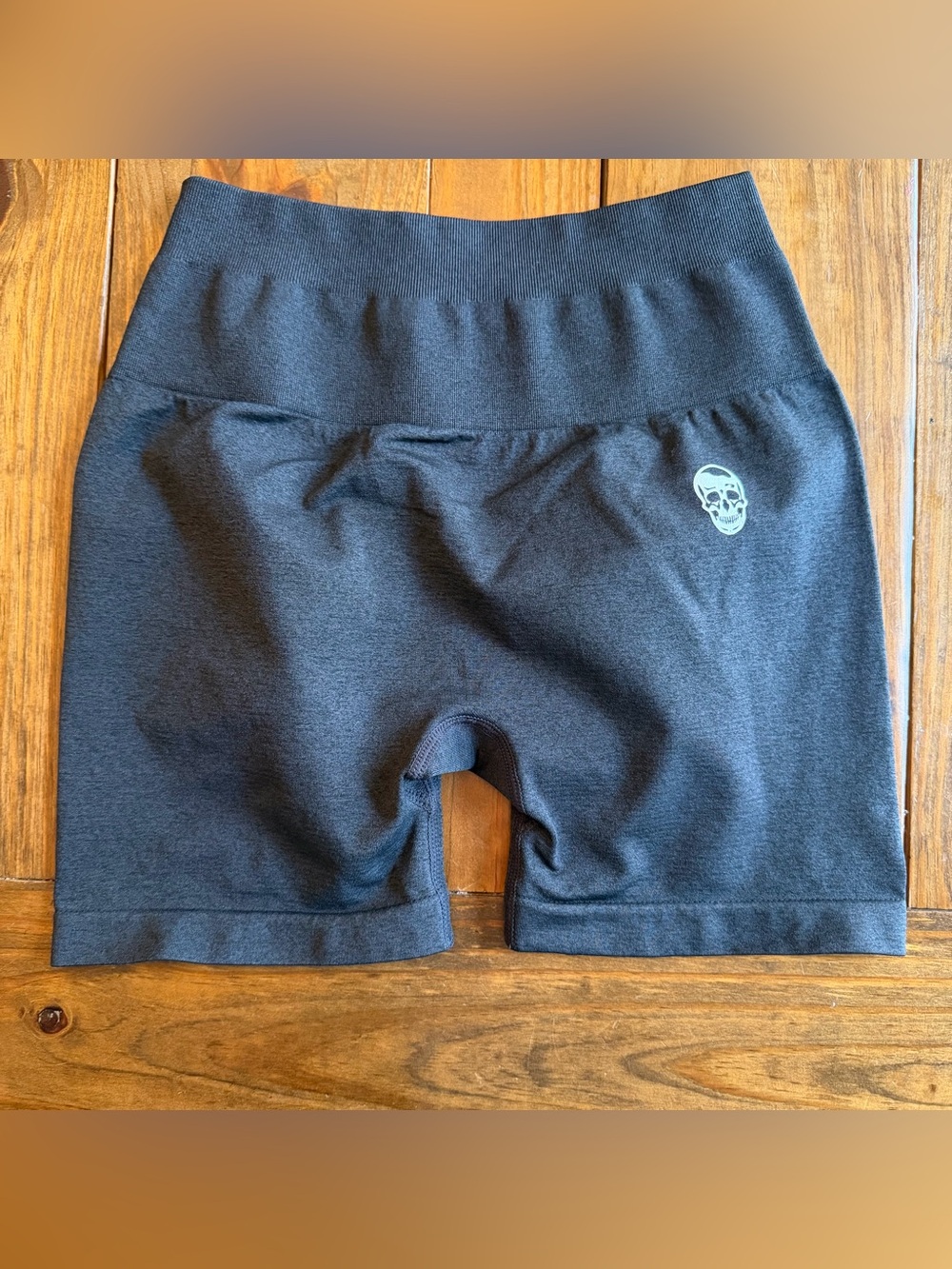 High-Waist Black Athletic Bike Shorts with Reflective Skull Accent